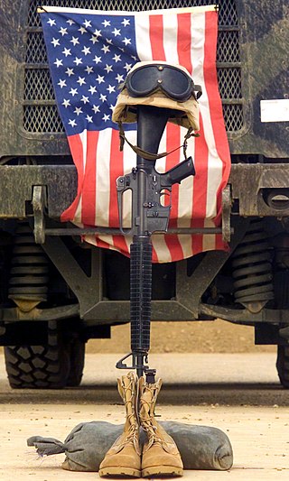 An M16 A2 service rifle, a pair of boots and a helmet stands in memory of Sergeant Padilla. Sergeant Padilla, from Marine Wing Support Squadron 371, was killed in action in Iraq during Operation Iraqi Freedom.